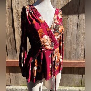 HD in Paris Wrap top. Burgundy w/ floral print. Size 10.